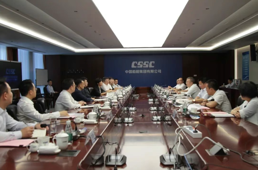 王国强与中国信保党委书记、董事长王浩会谈 